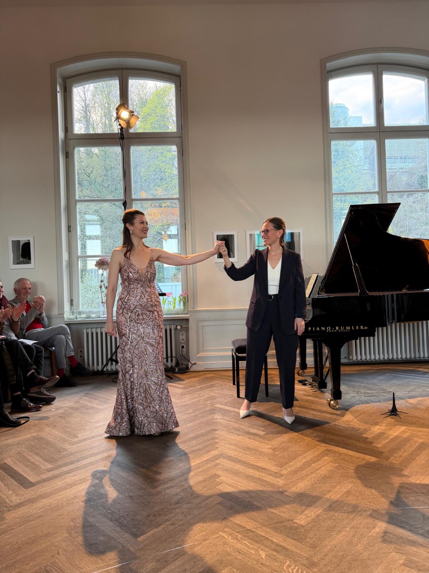 Taking a bow with a singer after a performance