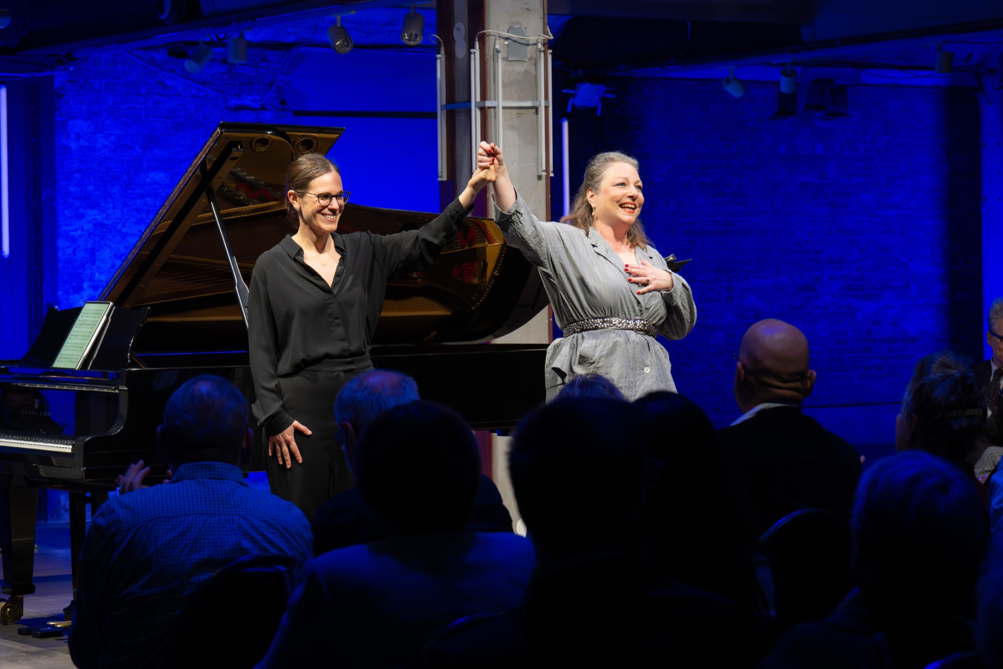 Yael Kareth bowing in performance